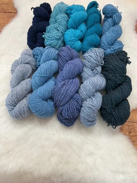 Navy, turquoise, jade, and blue heather Philosopher’s Wool skeins