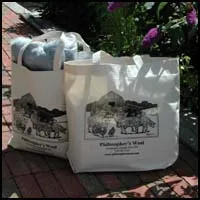 Philosopher’s Wool knitting bags displayed outdoors