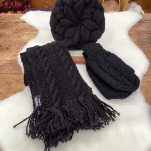 A pair of dark hand-knit mittens with a blue cuff