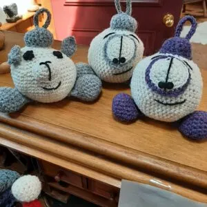 Small hand-knit Christmas ornaments in wool