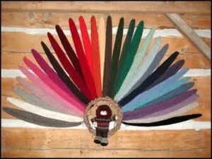 Philosopher’s Wool skeins fanned out by colour on a wooden surface